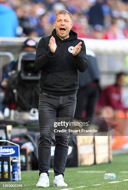 Frank Kramer , head coach of Bielefeld gestures during the Bundesliga match between DSC Arminia Bielefeld and FC Bayern München at Schueco Arena on...