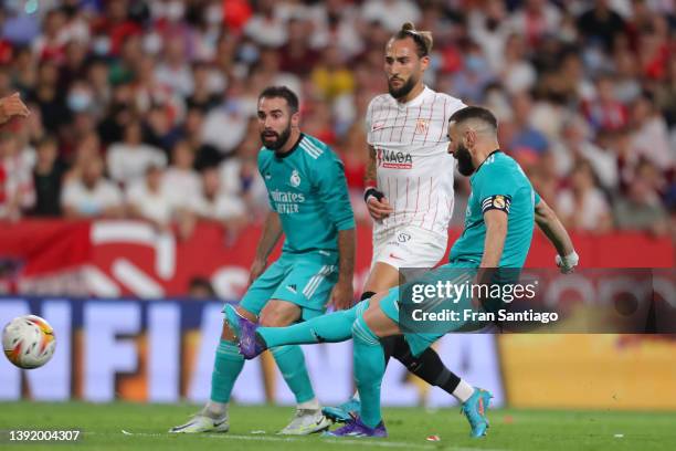 Karim Benzema of Real Madrid scores their team's third goal during the LaLiga Santander match between Sevilla FC and Real Madrid CF at Estadio Ramon...