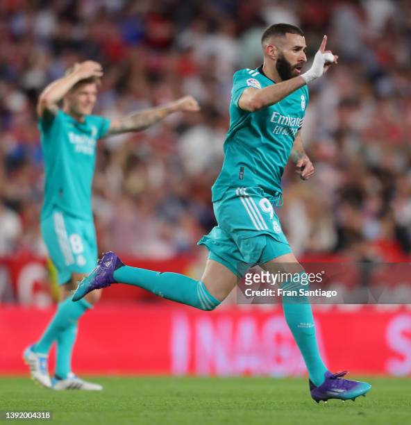 Karim Benzema of Real Madrid celebrates after he scores their team's third goal during the LaLiga Santander match between Sevilla FC and Real Madrid...