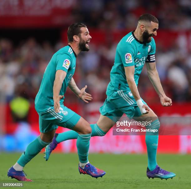 Karim Benzema of Real Madrid celebrates after he scores their team's third goal during the LaLiga Santander match between Sevilla FC and Real Madrid...