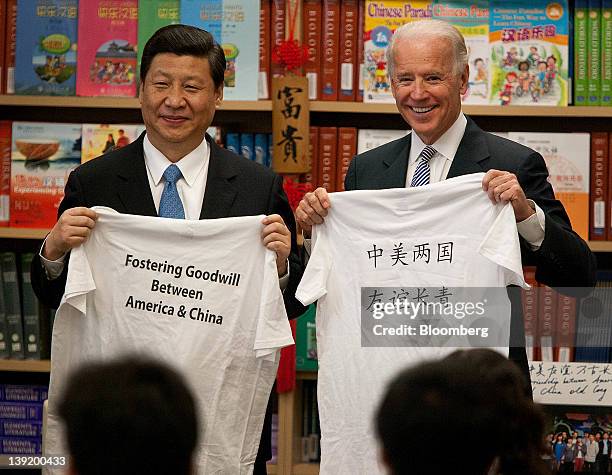 Xi Jinping, vice president of China, left, and U.S. Vice President Joe Biden stand for a photograph while visiting the International Studies Learning...