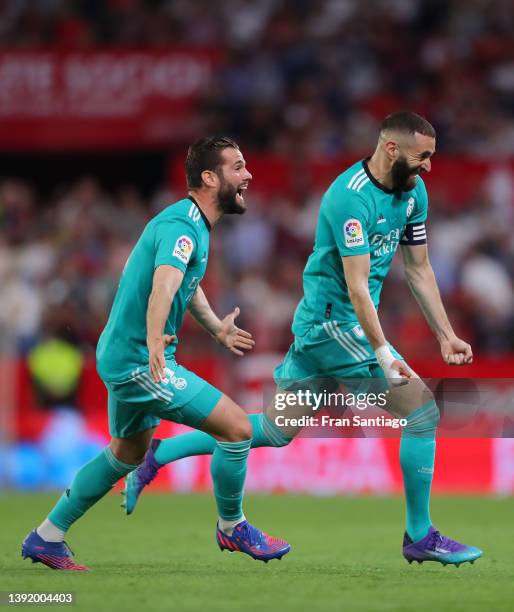 Karim Benzema of Real Madrid celebrates after he scores their team's third goal during the LaLiga Santander match between Sevilla FC and Real Madrid...