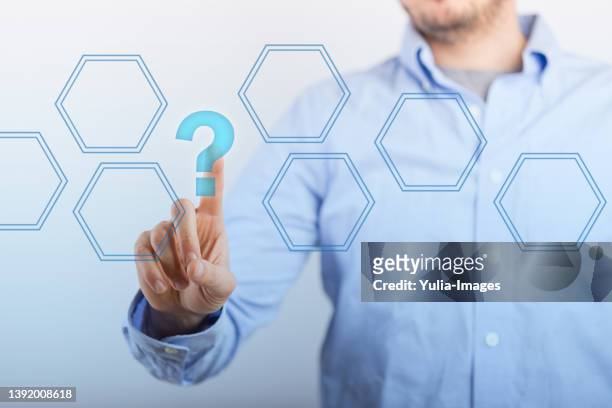 business man clik button screen with question mark - manquestionmark stock pictures, royalty-free photos & images
