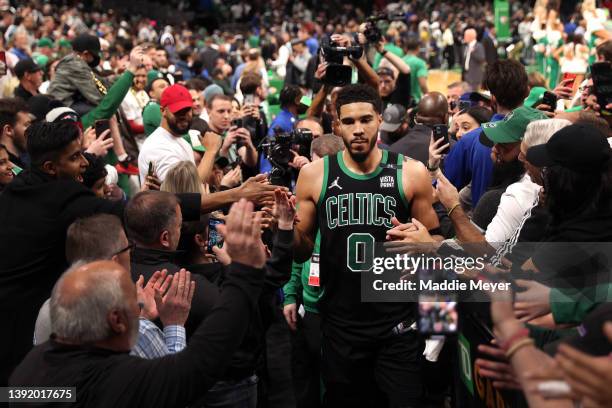 Jayson Tatum of the Boston Celtics walks through a crowd of fans after the Celtics defeat the Nets 115-114 in Round 1 Game 1 of the 2022 NBA Eastern...