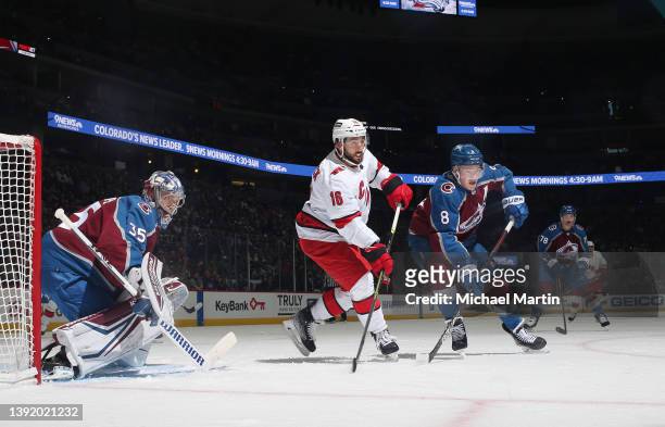 Vincent Trocheck of the Carolina Hurricanes skates against Cale Makar and goaltender Darcy Kuemper of the Colorado Avalanche at Ball Arena on April...