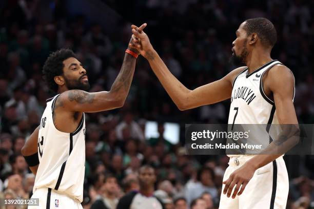 Kevin Durant of the Brooklyn Nets and Kyrie Irving celebrate during the fourth quarter of Round 1 Game 1 of the 2022 NBA Eastern Conference Playoffs...