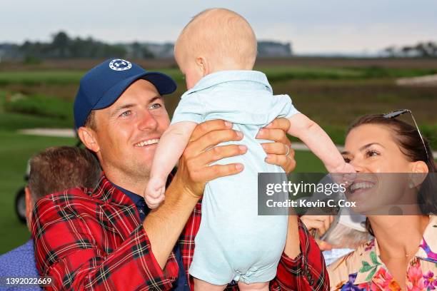 Jordan Spieth celebrates with son Sammy Spieth and wife Annie Verret after winning the RBC Heritage in a playoff at Harbor Town Golf Links on April...