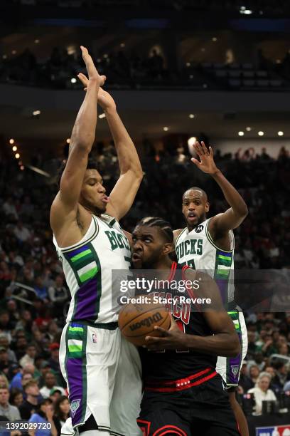 Patrick Williams of the Chicago Bulls is fouled by Giannis Antetokounmpo of the Milwaukee Bucks during the second quarter of Game One of the Eastern...