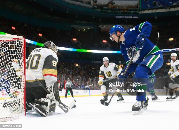 Robin Lehner of the Vegas Golden Knights makes a save on Alex Chiasson of the Vancouver Canucks during their NHL game at Rogers Arena April 12, 2022...