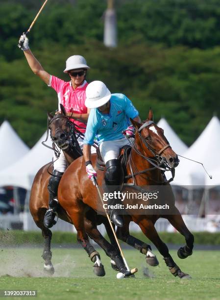 Jared Zenni of La Elina pursues Pablo Mac Donough of Aspen Valley as he brings the ball up field during the US Open Polo Championship Quarterfinal on...