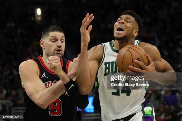 Giannis Antetokounmpo of the Milwaukee Bucks drives to the basket against Nikola Vucevic of the Chicago Bulls during the second half of Game One of...