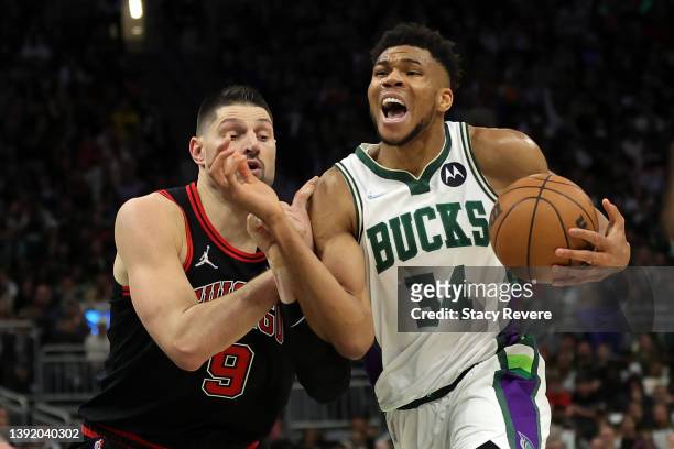 Giannis Antetokounmpo of the Milwaukee Bucks drives to the basket against Nikola Vucevic of the Chicago Bulls during the second half of Game One of...