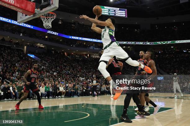 Giannis Antetokounmpo of the Milwaukee Bucks is fouled by DeMar DeRozan of the Chicago Bulls during the second half of Game One of the Eastern...
