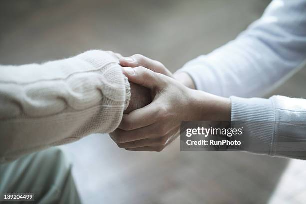 senior man and son,hands close-up - helping hand stockfoto's en -beelden