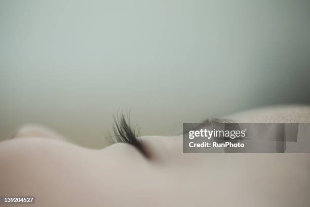 baby sleeping,eye close-up - baby sleep stock-fotos und bilder