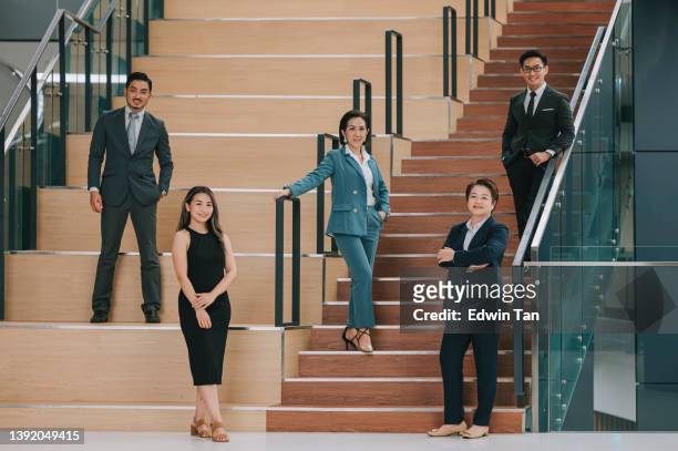 group of asian chinese successful office management team portrait looking at camera in office smiling - organized group photo 個照片及圖片檔