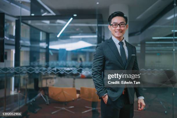 portrait asian chinese white collar worker in suit looking at camera smiling - formal businesswear stock pictures, royalty-free photos & images