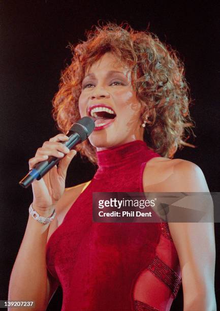 Whitney Houston performs on stage in 1996.