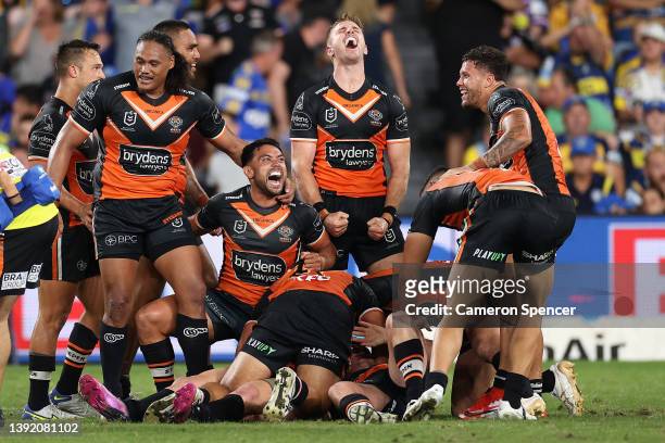 Jackson Hastings of the Wests Tigers celebrates kicking the winning field goal during the round six NRL match between the Parramatta Eels and the...