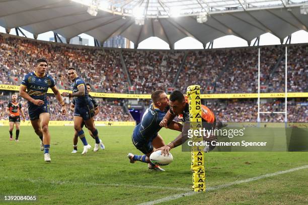 Ken Maumalo of the Wests Tigers scores a try during the round six NRL match between the Parramatta Eels and the Wests Tigers at CommBank Stadium on...