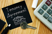 Tenancy agreement is shown on the photo using the text