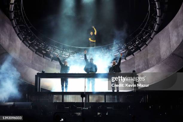 Axwell and Sebastian Ingrosso of Swedish House Mafia, The Weeknd, and Steve Angello of Swedish House Mafia perform onstage at the Coachella Stage...