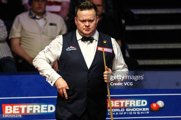 Shaun Murphy of England reacts in the first round match against Stephen Maguire of Scotland on day two of the 2022 Betfred World Snooker Championship...