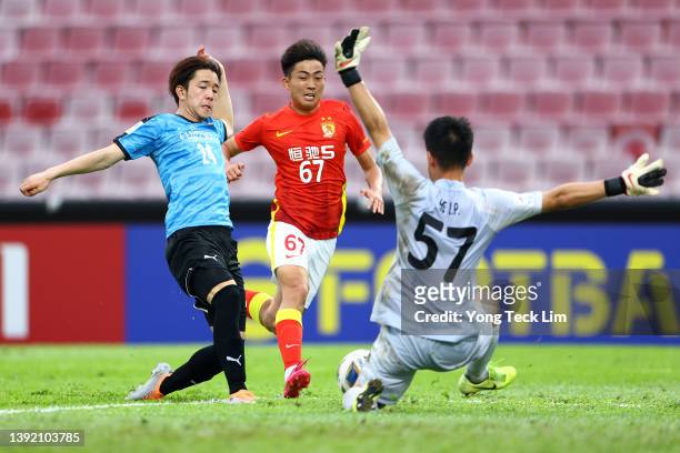 Ten Miyagi of Kawasaki Frontale scores his team's sixth goal against Chen Kun and goalkeeper He Lipan of Guangzhou FC during the second half of the...
