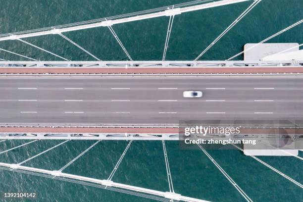 sea crossing bridge at sunset. - highways stock pictures, royalty-free photos & images