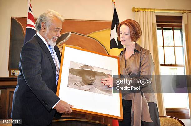 Australian Prime Minister Julia Gillard presents East Timorese Prime Minister Xanana Gusmao with a photographic portrait from the Australian National...