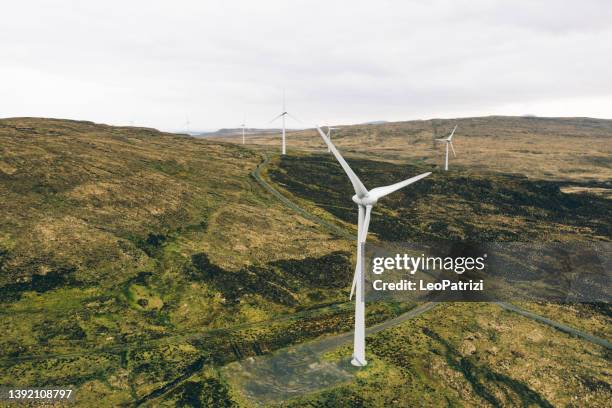 wind turbine farm in a rural area - isle of skye aerial stock pictures, royalty-free photos & images