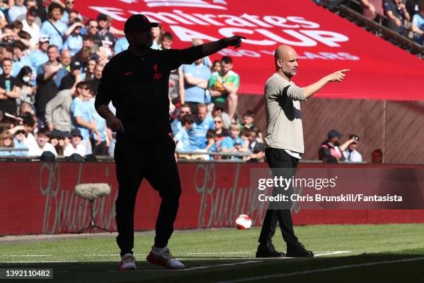 Manchester City manager Josep Guardiola gestures from the touchline next to Liverpool manager Jurgen Klopp during The Emirates FA Cup Semi-Final...