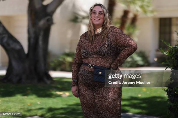 Verena Prechtl seen wearing a brown sunglasses, a gold statement necklace, a brown transparent leo print maxi dress, a black leather belt bag from...