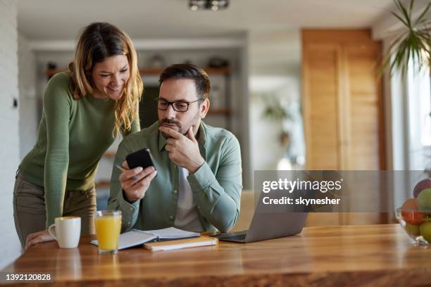 take a look at this text message! - couple with smart phone stock pictures, royalty-free photos & images