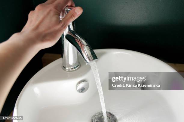water tap - women with health faucet stock pictures, royalty-free photos & images