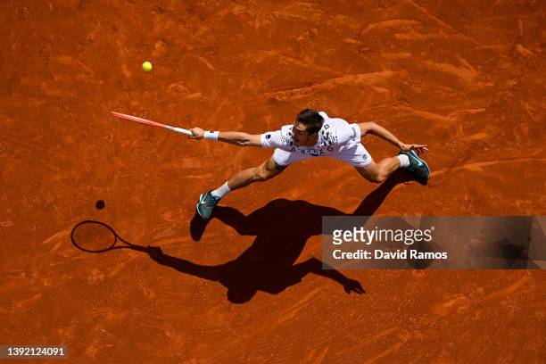 Egor Gerasimov of Belarus plays a backhand against Adrian Mannarino of France during day 1 of the ATP500 Barcelona Open Banc Sabadell at Real Club De...