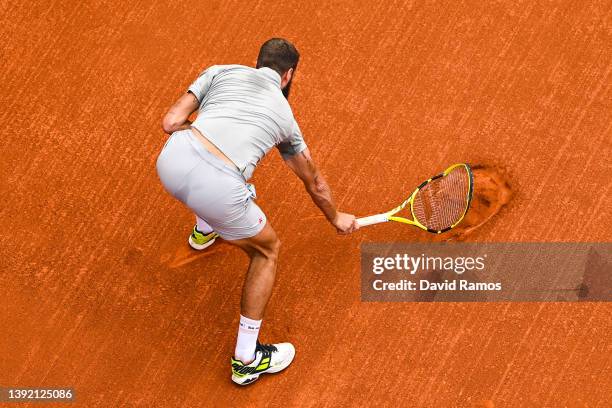 Benoit Paire of France smashes his racket after losing the first set against Soonwoo Kwon of South Korea during day 1 of the ATP500 Barcelona Open...