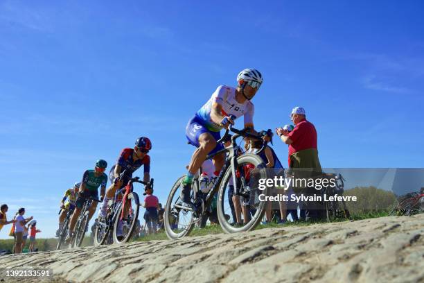 General view of the peloton compete in "Pont-Thibault" cobblestones sector of 119th Paris-Roubaix 2022 - Men's Elite on April 17, 2022 in Roubaix,...