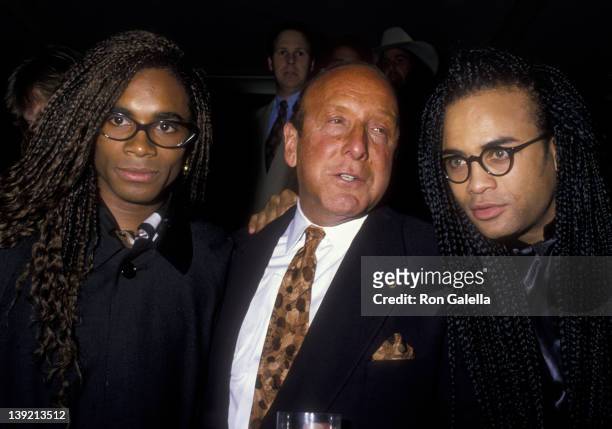 Musicians Rob Pilatus and Fab Morvan of Milli Vanilli and Clive Davis attend Arista Records Pre-Grammy Awards Party on February 20, 1990 at the...
