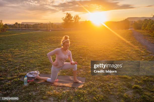 woman exercising whit dumbell in nature - oslo city life stock pictures, royalty-free photos & images