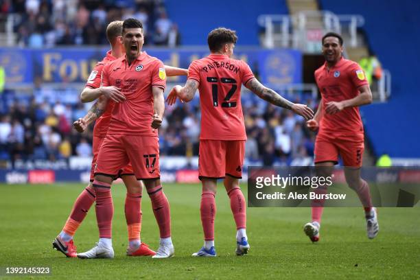 Joel Piroe of Swansea City celebrates scoring their side's second goal with teammates during the Sky Bet Championship match between Reading and...