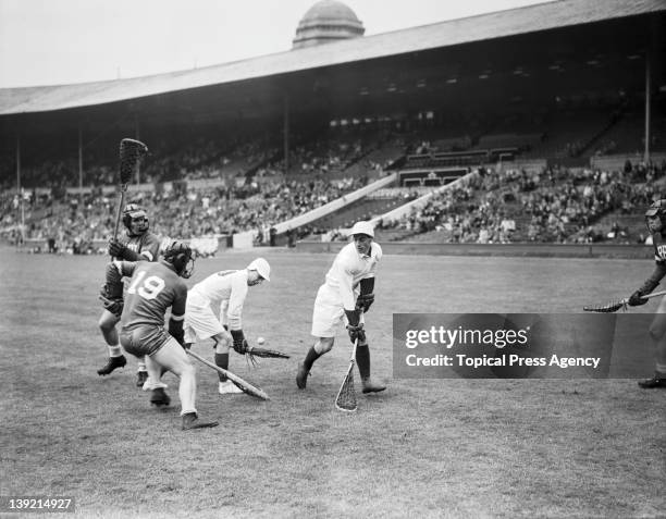 An all-England lacrosse team playing the Rensselaer team from the USA in a demonstration match at Wembley Stadium, during the London Olympic Games,...