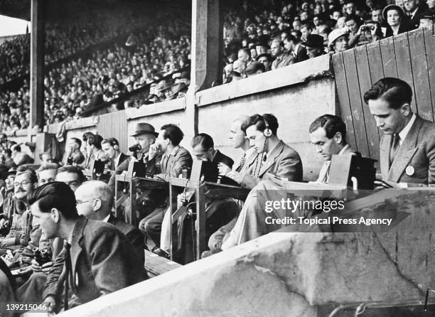 Radio commentators in the stands at Wembley Stadium during the London Olympic Games, August 1948.