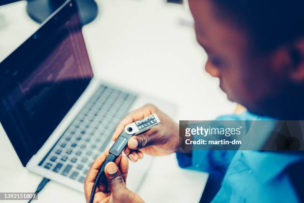 man using crypto hardware wallet - entering pin stock pictures, royalty-free photos & images