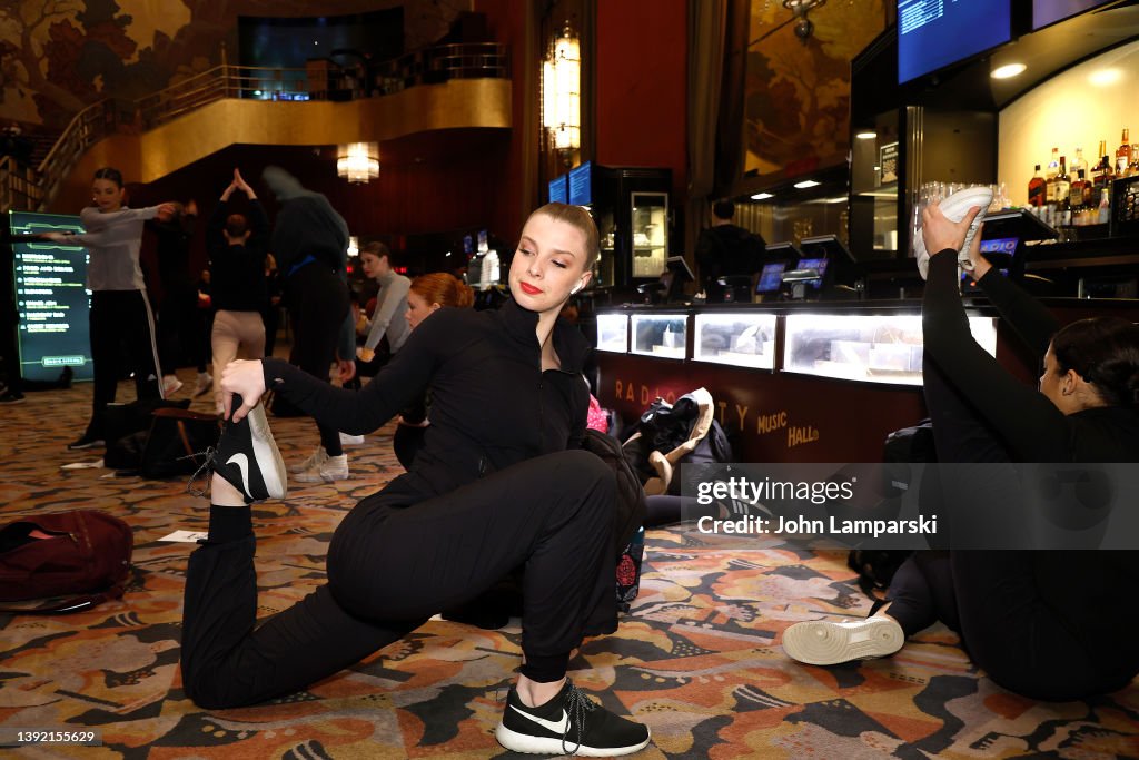 Raven Roockette Dancers stretch in the lobby during 2022 Radio City Rockettes... News ...