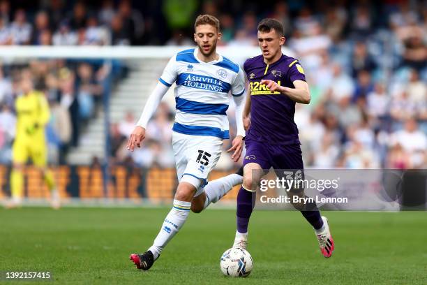 Sam Field of Queens Park Rangers challenges Jason Knight of Derby County during the Sky Bet Championship match between Queens Park Rangers and Derby...