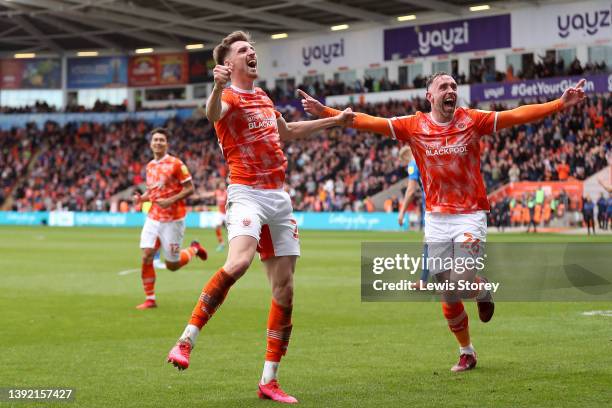 Jake Beesley of Blackpool celebrates scoring their side's fourth goal with teammate Richard Keogh during the Sky Bet Championship match between...