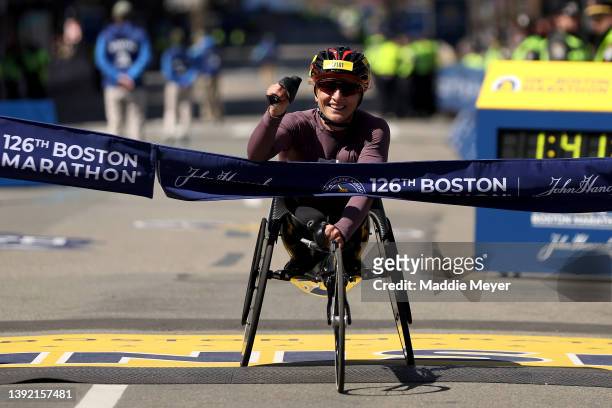Manuela Schar of Switzerland crosses the finish line and takes first place in the women's wheelchair division during the 126th Boston Marathon on...