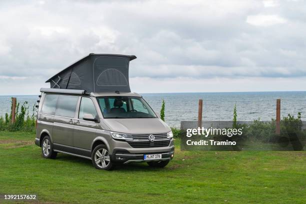 motorhome volkswagen parked on a grass - vw kombi stock pictures, royalty-free photos & images