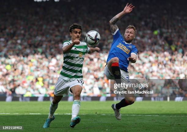 Scott Arfield of Rangers vies with Jota of Celtic during the Scottish Cup Semi Final match between Celtic FC and Rangers FC at Hampden Park on April...